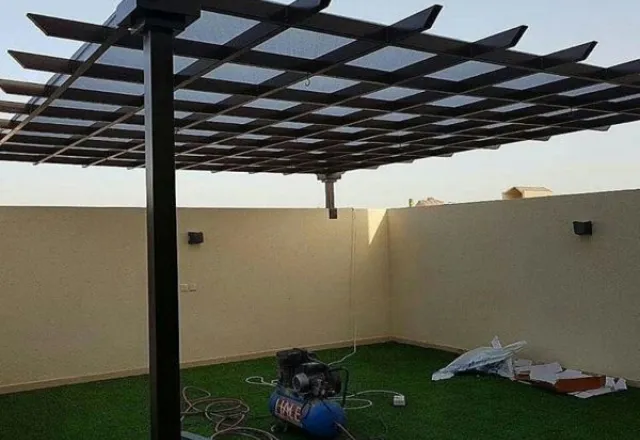 برجولة وتنسيق حديقة في حي النرجس